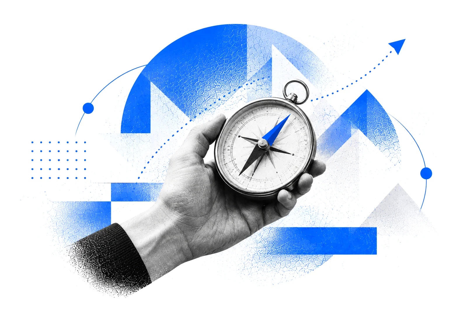 A hand holding a compass with a blue needle and a dotted arrow pointing up and to the right
